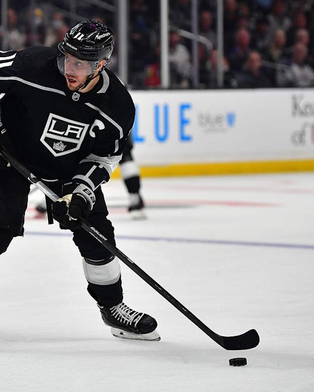 May 12, 2022; Los Angeles, California, USA; Los Angeles Kings center Anze Kopitar (11) controls the puck against the Edmonton Oilers during the second period in game six of the first round of the 2022 Stanley Cup Playoffs at Crypto.com Arena. Mandatory Credit: Gary A. Vasquez-USA TODAY Sports